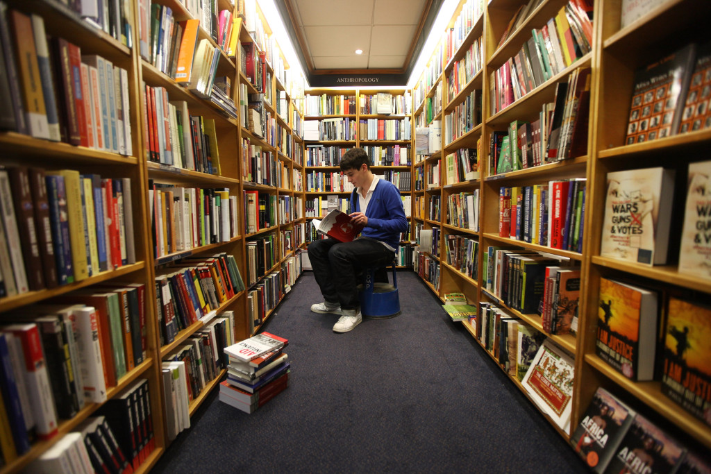 OXFORD, ENGLAND - OCTOBER 08:  First year student Tom Partington peruses the books in Blackwell bookshop as Oxford University commences its academic year on October 8, 2009 in Oxford, England. Oxford University has a student population in excess of 20,000 taken from over 140 countries around the world. The University is made up of 38 independent, self-governing colleges, three of which: University College, Balliol College, and Merton College, were established by the 13th century. According to the QS/Times Higher Education rankings, Oxford has slipped down the international league table from fourth to a joint fifth place with Imperial College London.  (Photo by Oli Scarff/Getty Images)